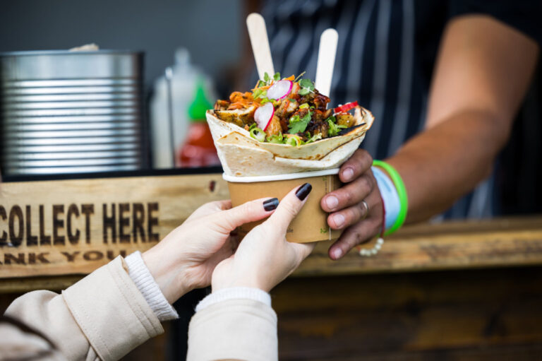 Handing over street food 768x511