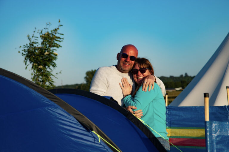 camping couple cuddle 768x512